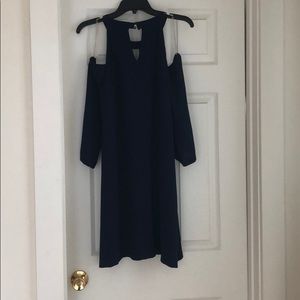 Navy blue drop sleeve cocktail dress.